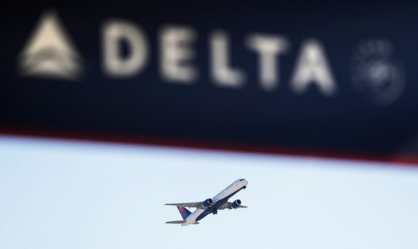 A Delta Air Lines flight takes off from Hartsfield-Jackson Atlanta International Airport in...