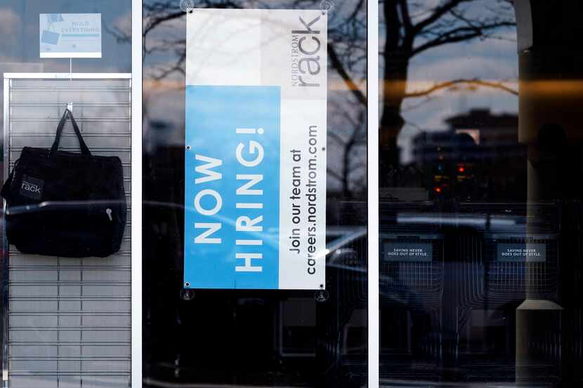 FILE - A hiring sign is seen at a retail store in Schaumburg, Ill., Friday, April 1, 2022.  ...