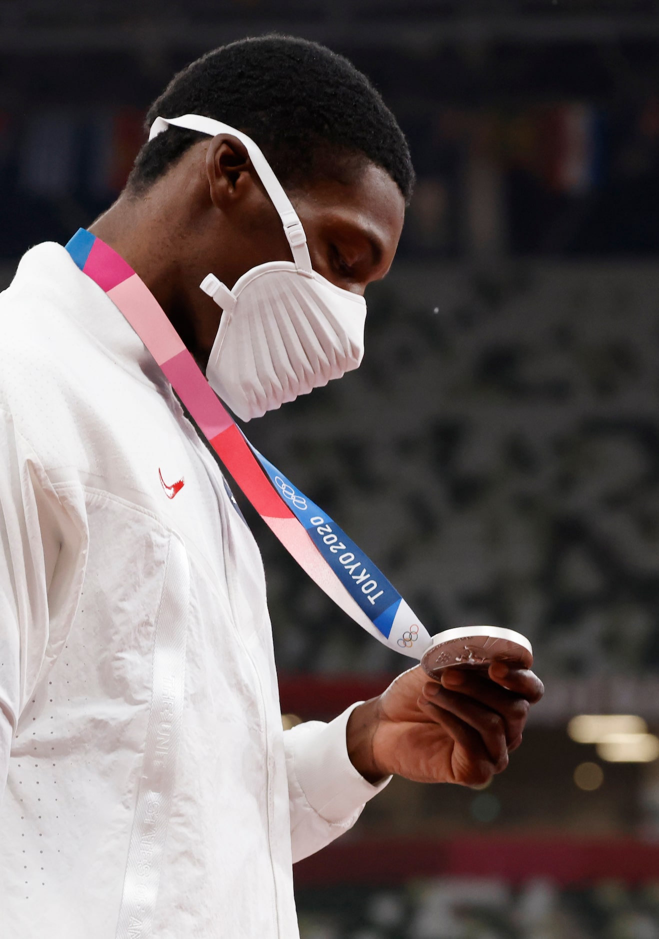 USA’s Fred Kerley takes a closer look at the silver medal he earned for his 9.84 second...