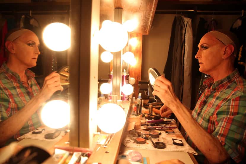 Coy Covington applies makeup for  The Tribute Artist.