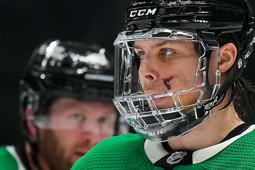 Dallas Stars defenseman Miro Heiskanen wears a full face guard to protect the cut he took on...