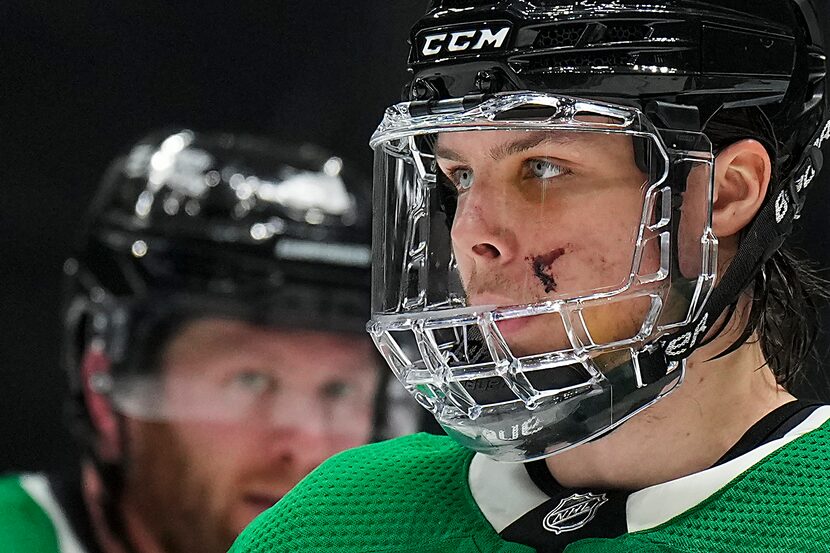 Dallas Stars defenseman Miro Heiskanen wears a full face guard to protect the cut he took on...