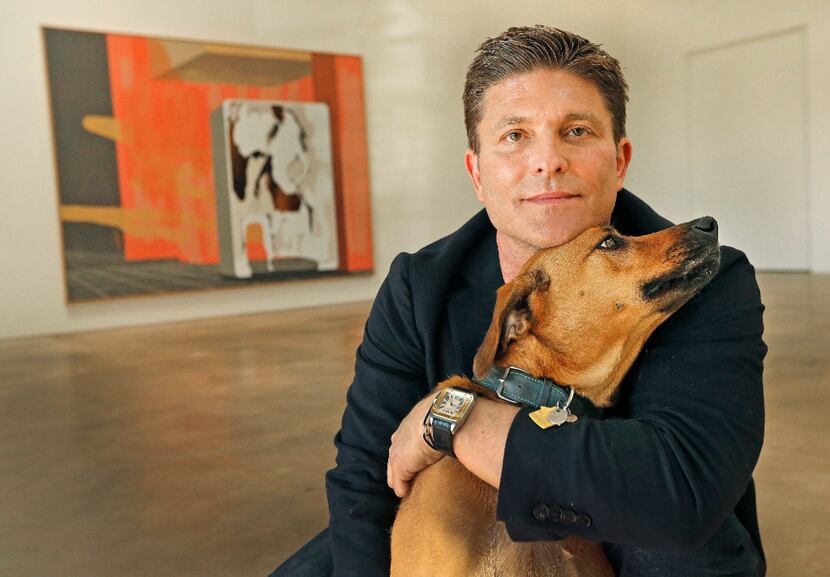 Kenny Goss with his dog Dixie at the Goss-Michael Foundation in Dallas. (Louis DeLuca/The...