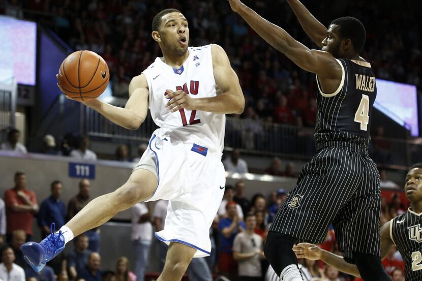 Mar 1, 2014; Dallas, TX, USA; Southern Methodist Mustangs guard Nick Russell (12) passes the...
