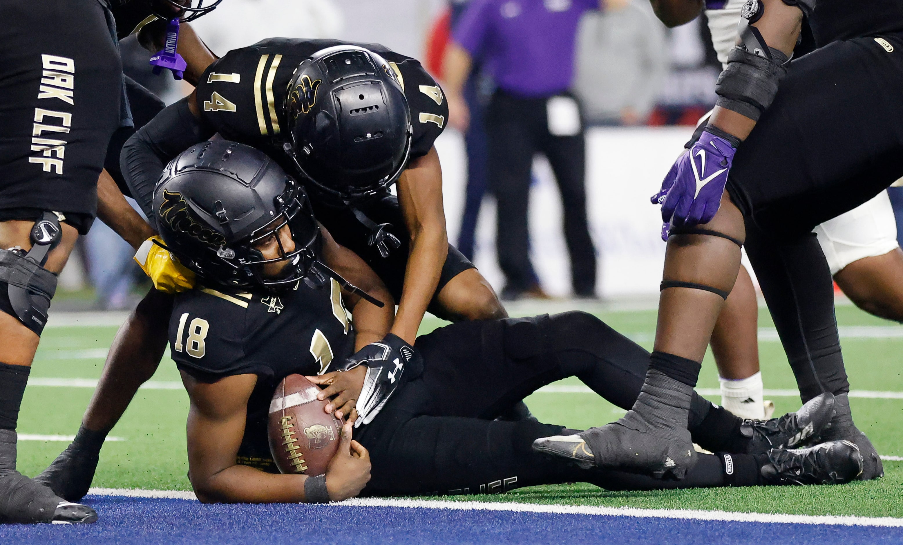 South Oak Cliff quarterback William Little (18) is congratulated by wide receiver Corthian...