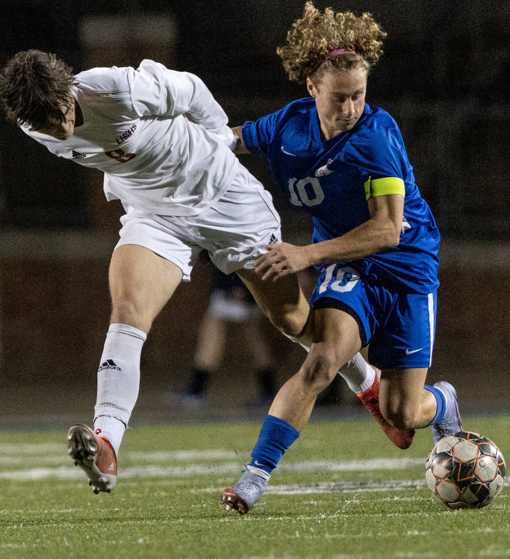 Lake Highlands High School Jake Bernhard  loses possession of the ball to Allen High School...