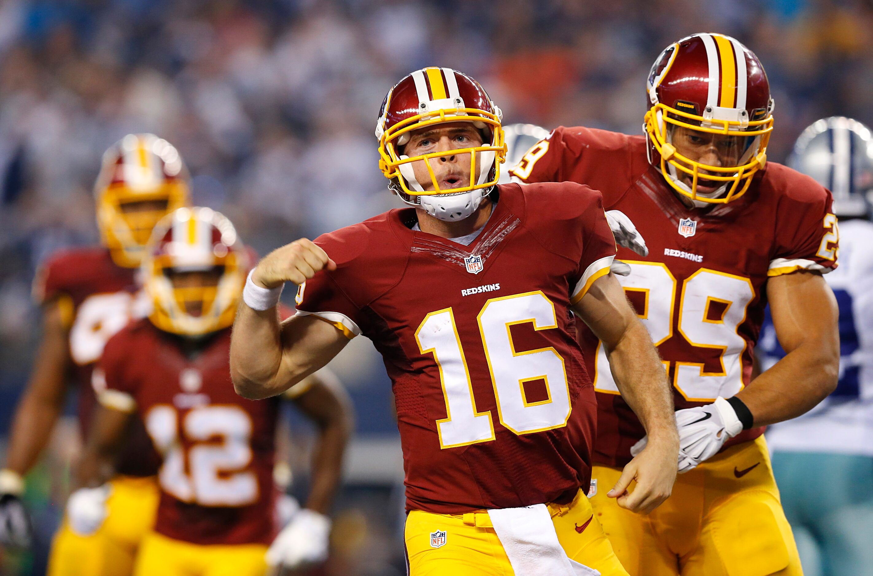 Washington Redskins quarterback Colt McCoy (16) celebrates his fourth quarter touchdown with...