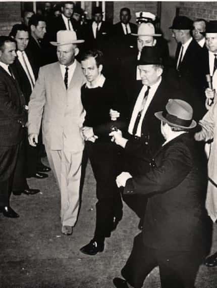 Jack Ruby, Dallas nightclub owner, steps out with a gun in hand a moment before Lee Harvey...