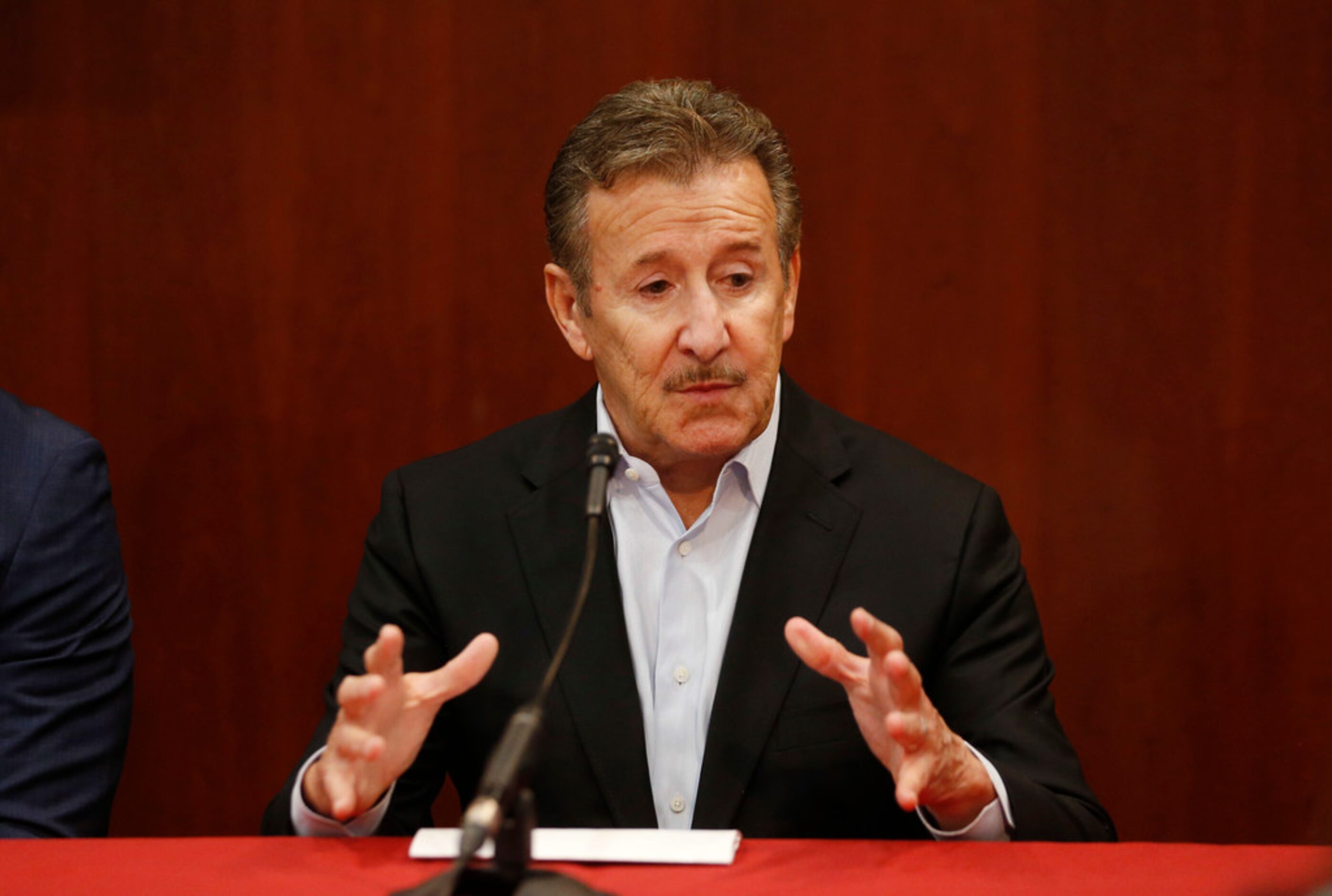 Los Angeles Angels owner Arte Moreno answers questions during a press conference before a...