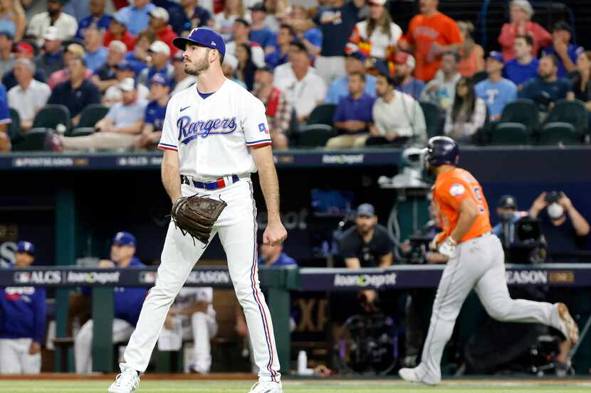 Texas Rangers relief pitcher Cody Bradford (61) watches as Houston Astros Jose Abreu (left)...