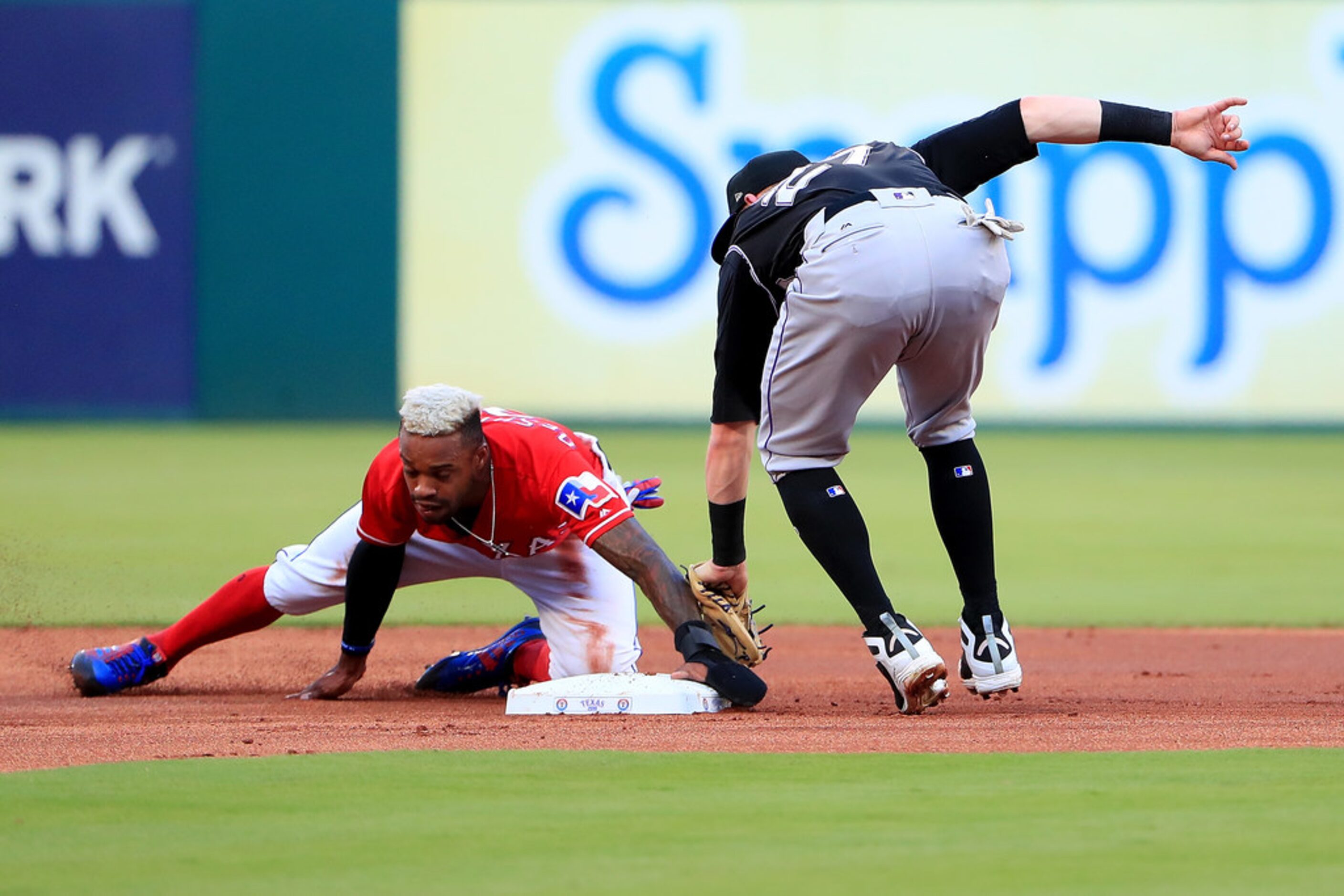 ARLINGTON, TX - JUNE 15:  Delino DeShields #3 of the Texas Rangers slides into second base...