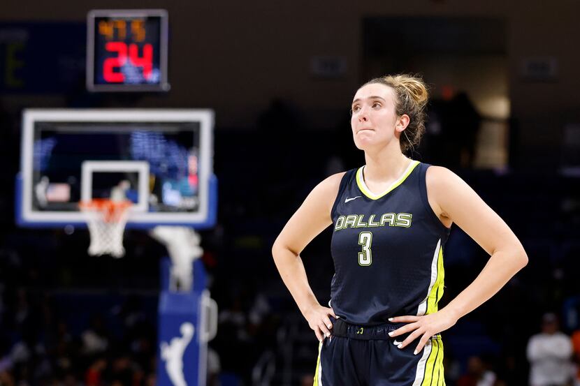 Dallas Wings guard Marina Mabrey (3) watches as the final minute ticks off the clock in...