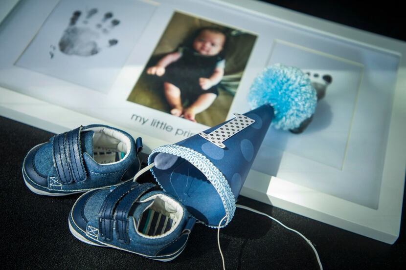 Mementos from her son Aidan's first year are a few of the items Cathy Pham retrieved from...