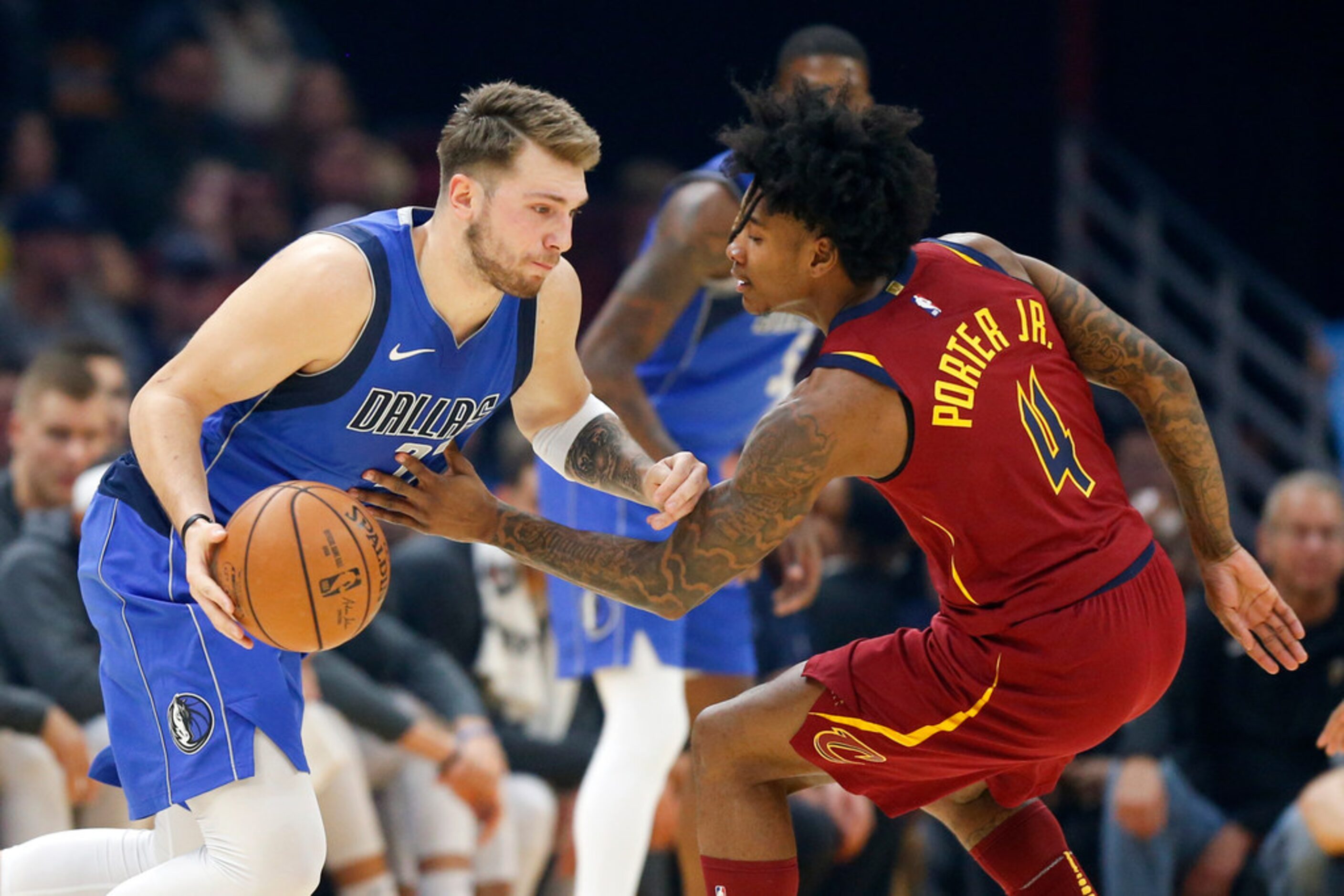 Dallas Mavericks' Luka Doncic drives against Cleveland Cavaliers' Kevin Porter Jr. in the...