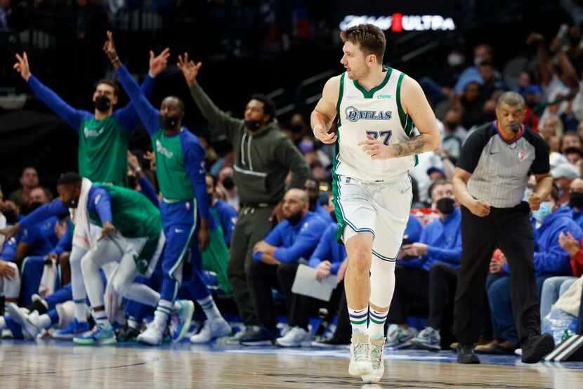 Dallas Mavericks guard Luka Doncic celebrates a 3-pointer during the fourth quarter against...