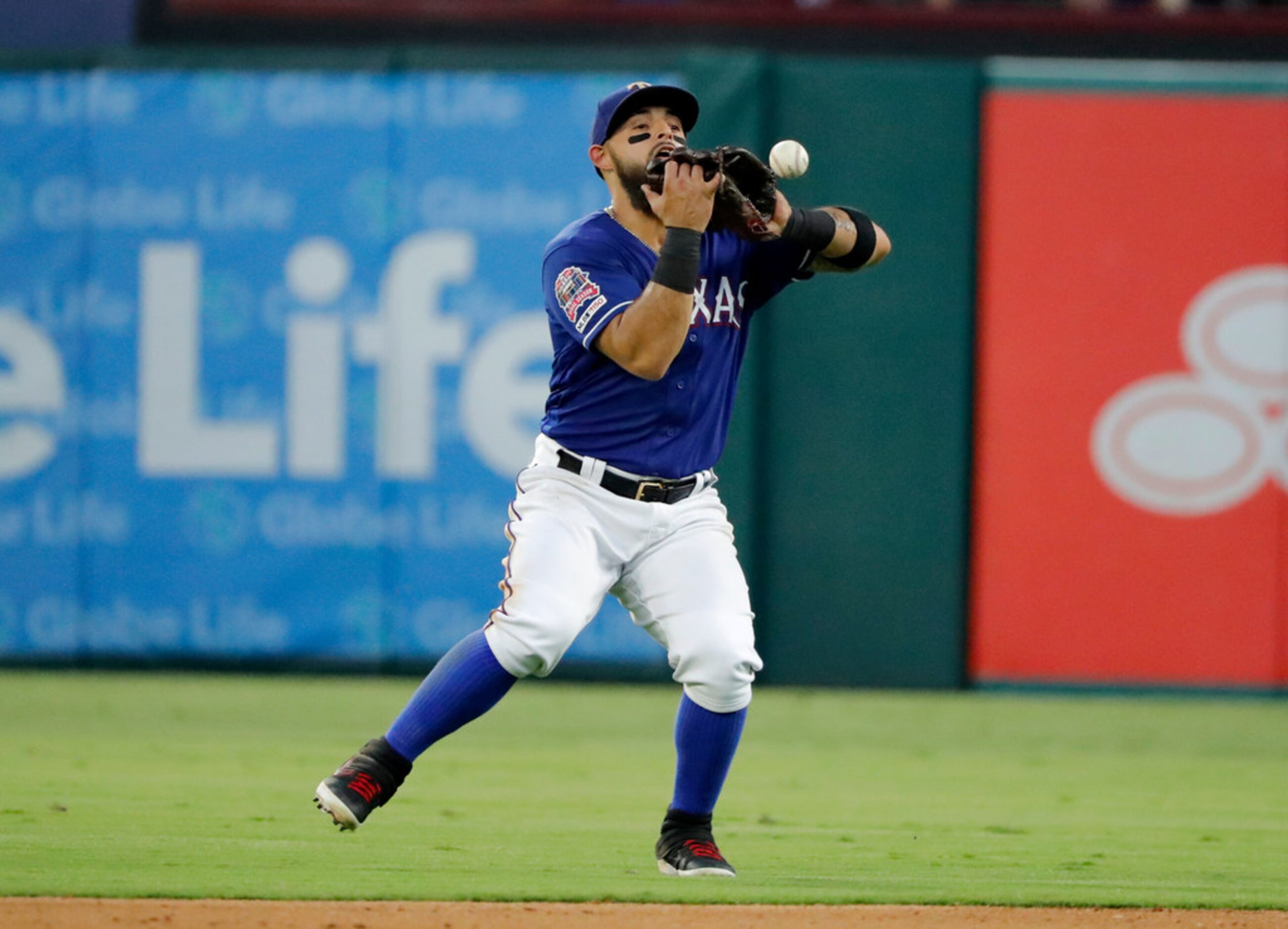 Texas Rangers second baseman Rougned Odor drops a popup by Minnesota Twins' Miguel Sano,...