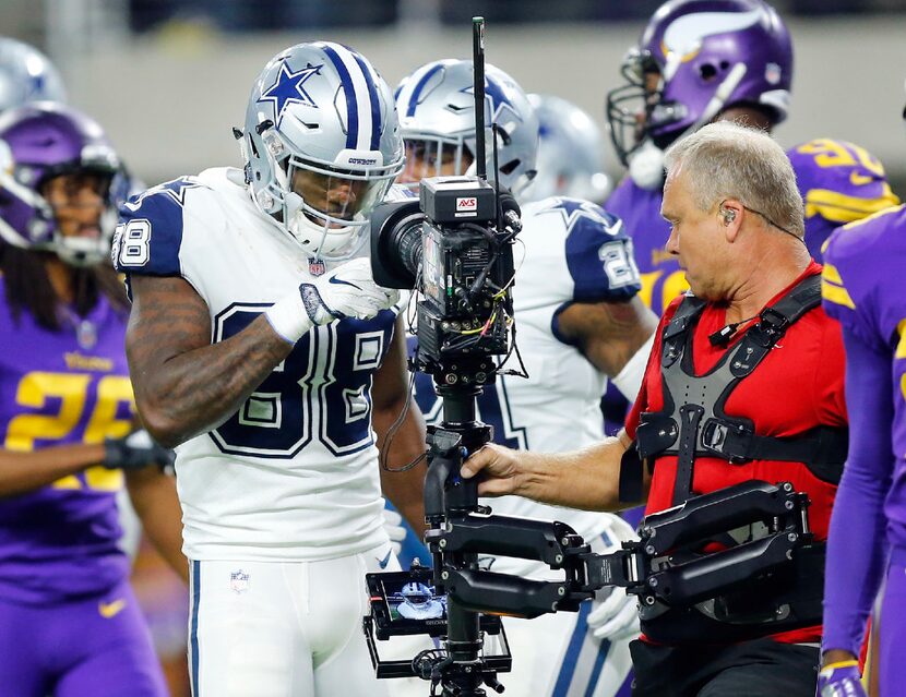 Dallas Cowboys wide receiver Dez Bryant (88) plays to the camera after scoring his fourth...