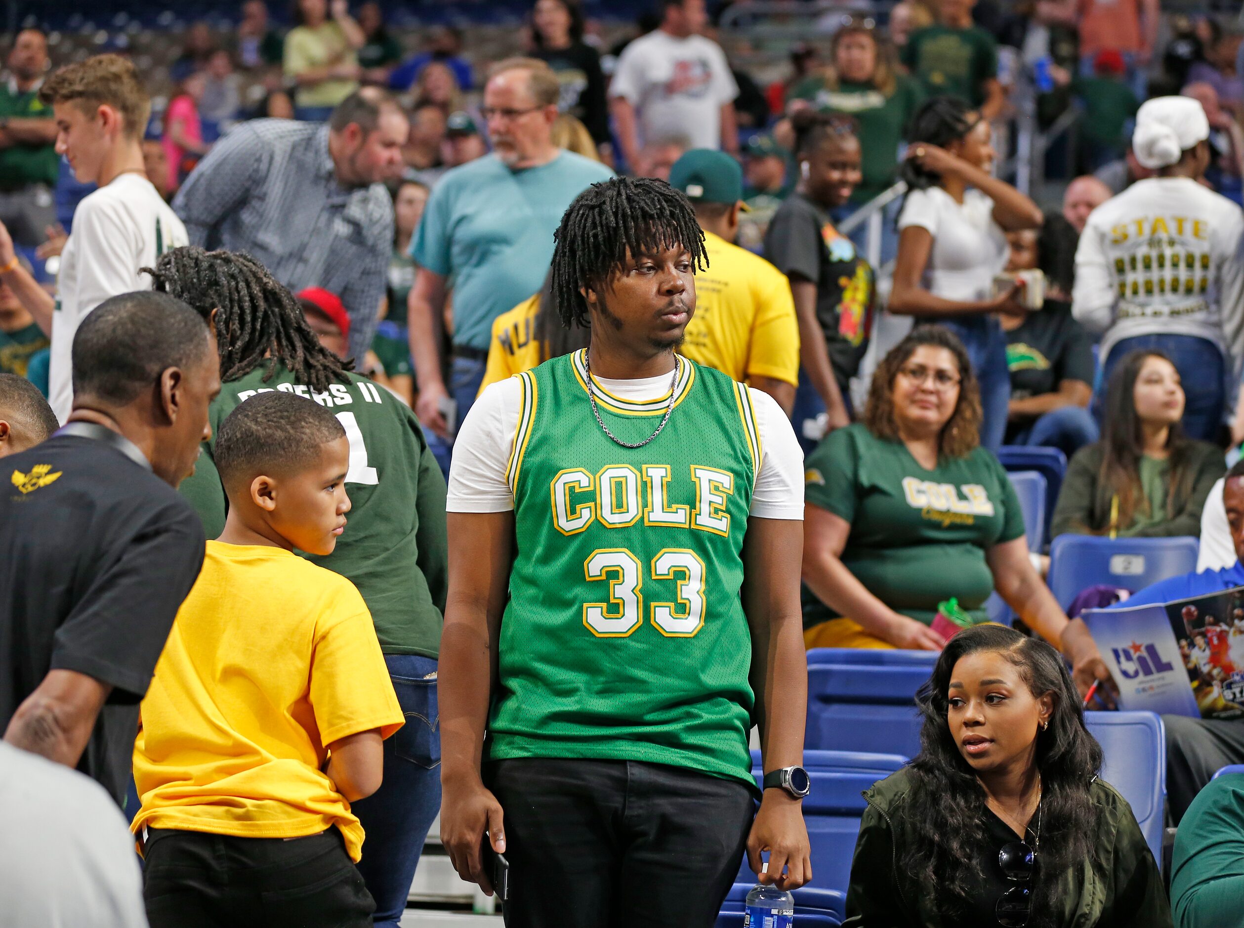 While Madison fans leave, San Antonio Cole fan Rashad White prepares to watch the last game...