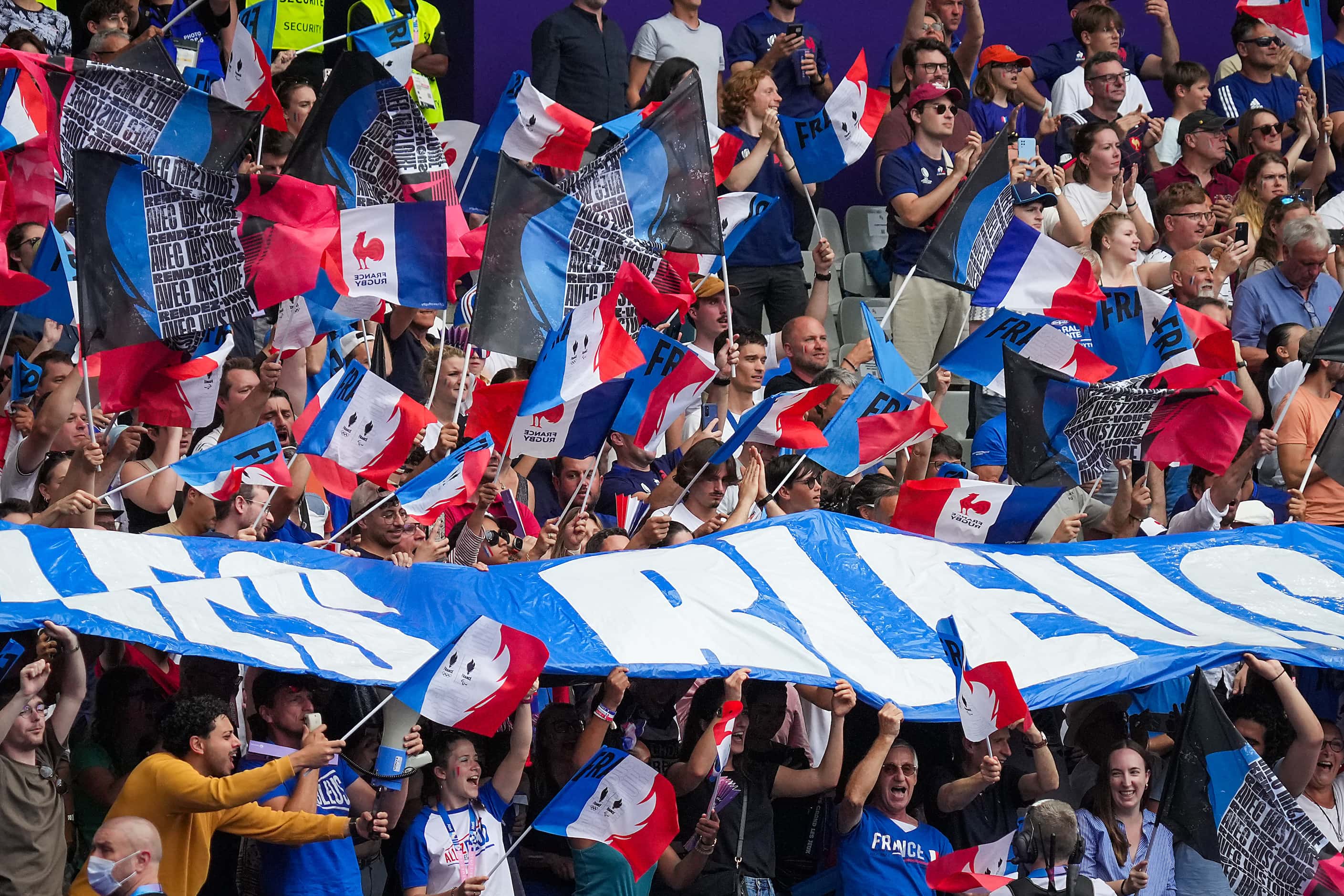 French fans cheer as their team take sthe field to face the United States in a men’s rugby...
