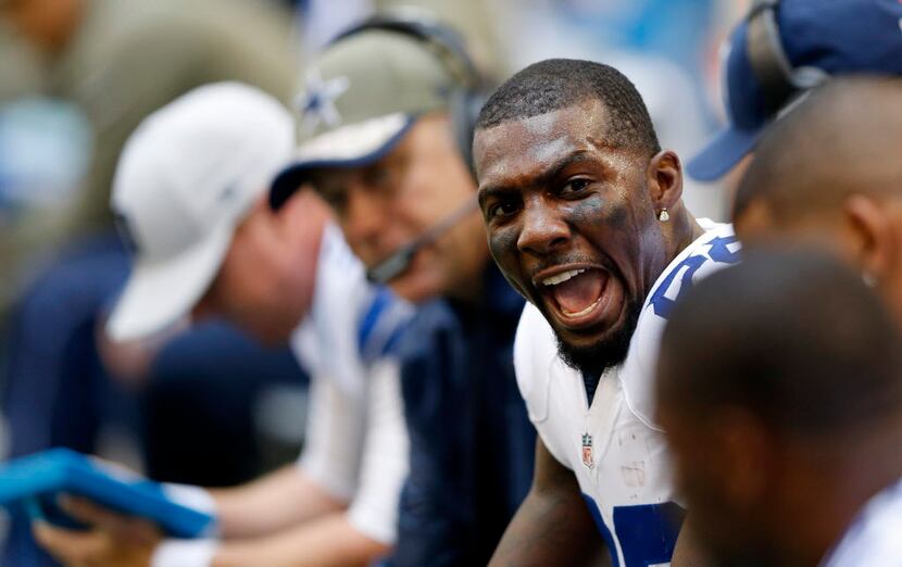 Dallas Cowboys wide receiver Dez Bryant (88) attempts to keep the spirits up on the bench...