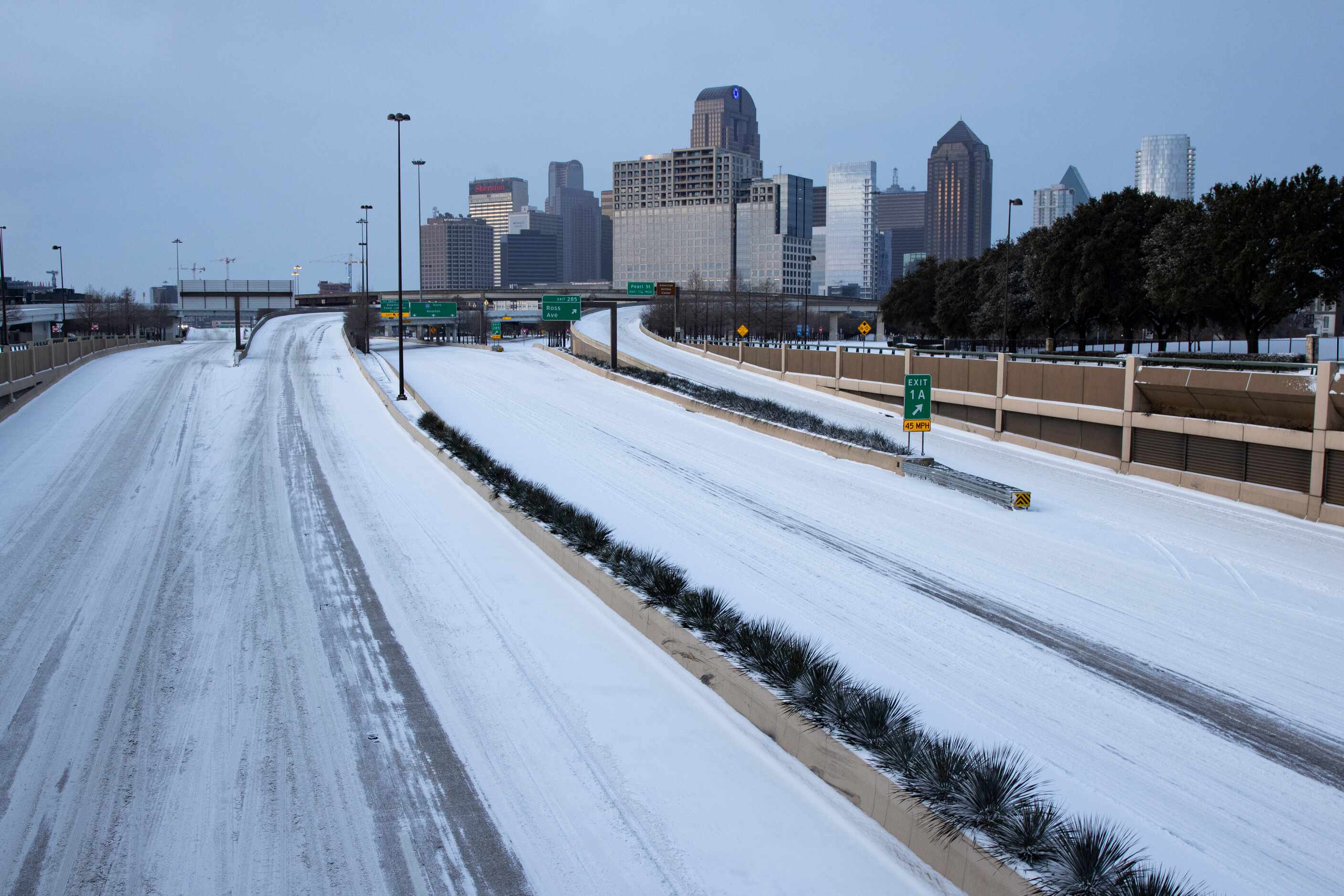 Snow covers US 75 heading into Downtown in Dallas on Monday morning, Feb. 15, 2021. (Juan...