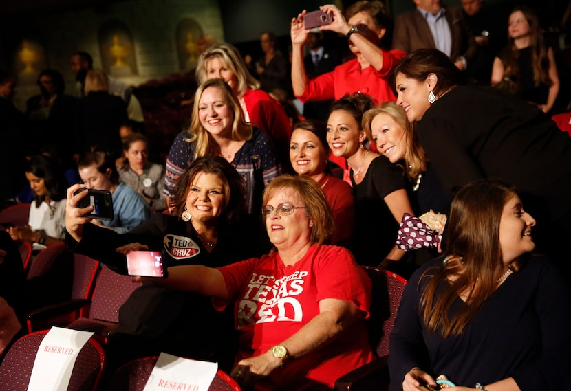 Michelle Smith (bottom left) and Kelly Canon take a selfie with others prior to the start of...