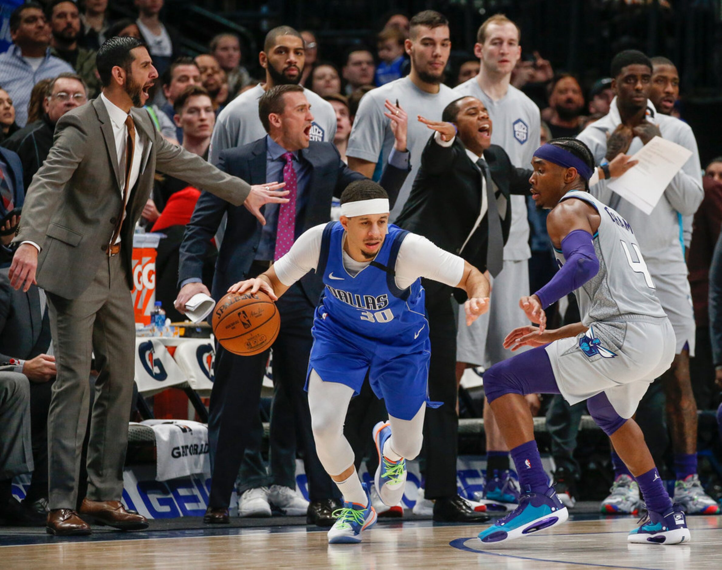 Dallas Mavericks guard Seth Curry (30) makes a break past Charlotte Hornets guard Devonte'...