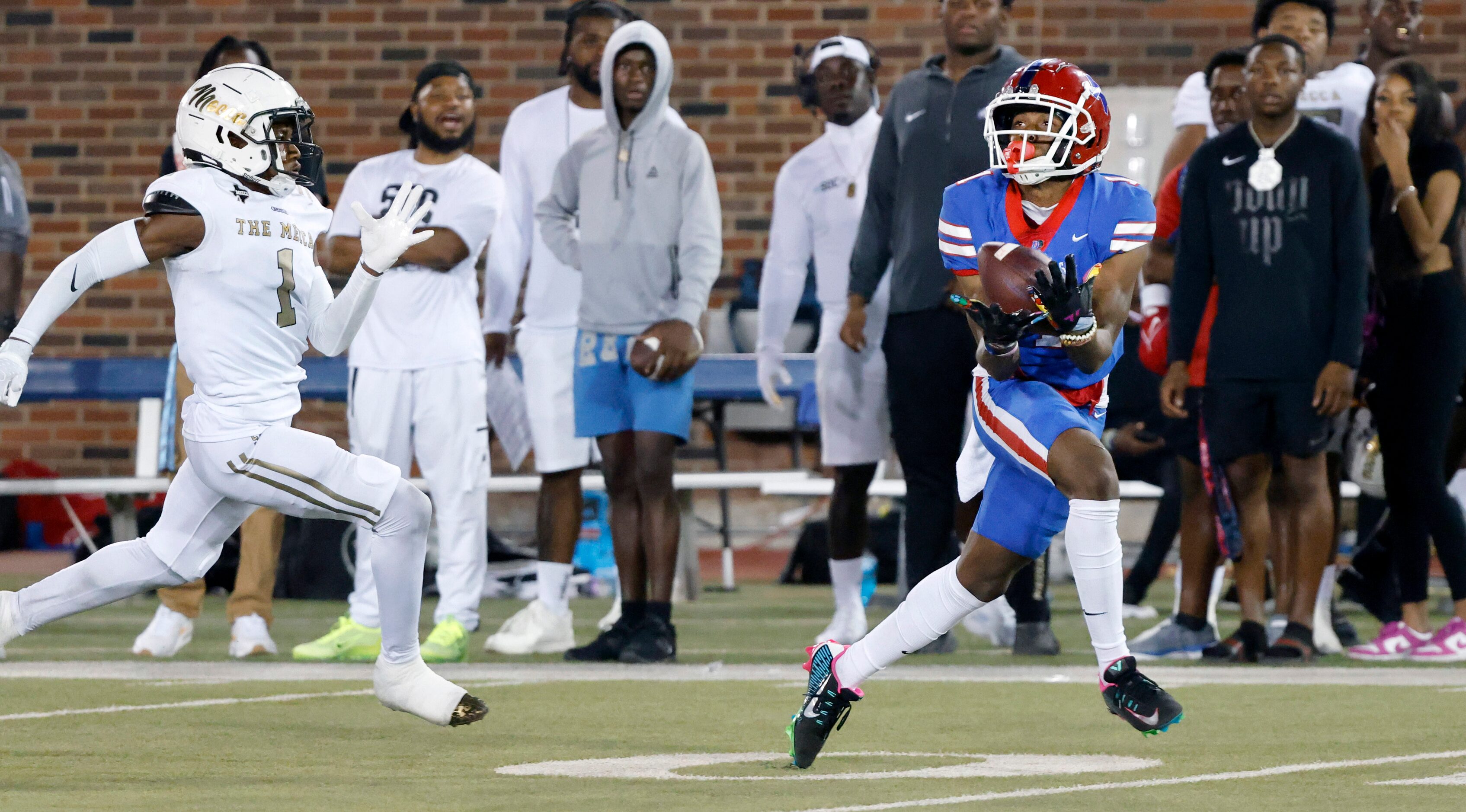 Duncanville wide receiver Dakorien Moore (1) hauls in a long touchdown catch against South...