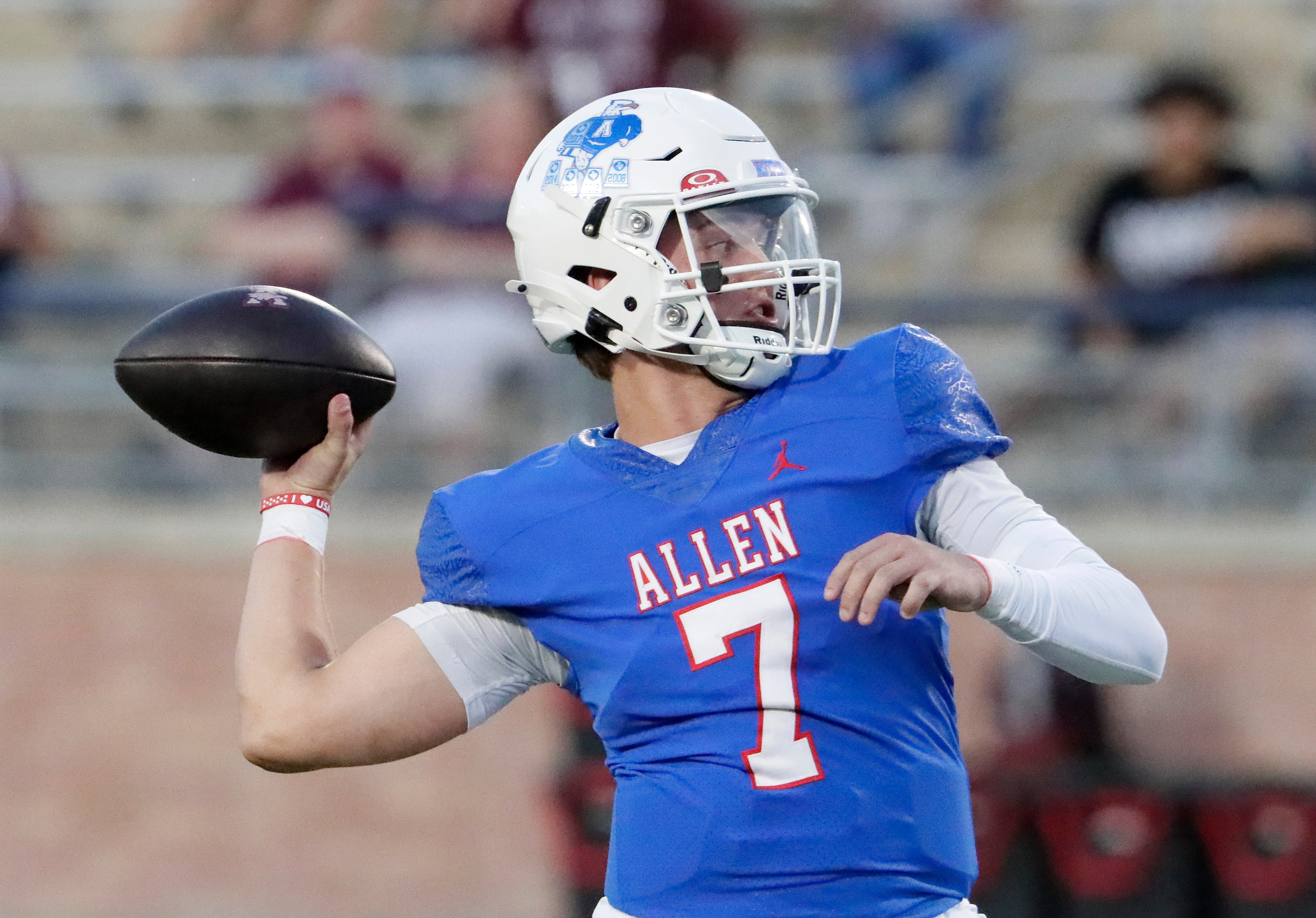 Allen High School quarterback Brady Bricker (7) throws a pass during the first half as Allen...