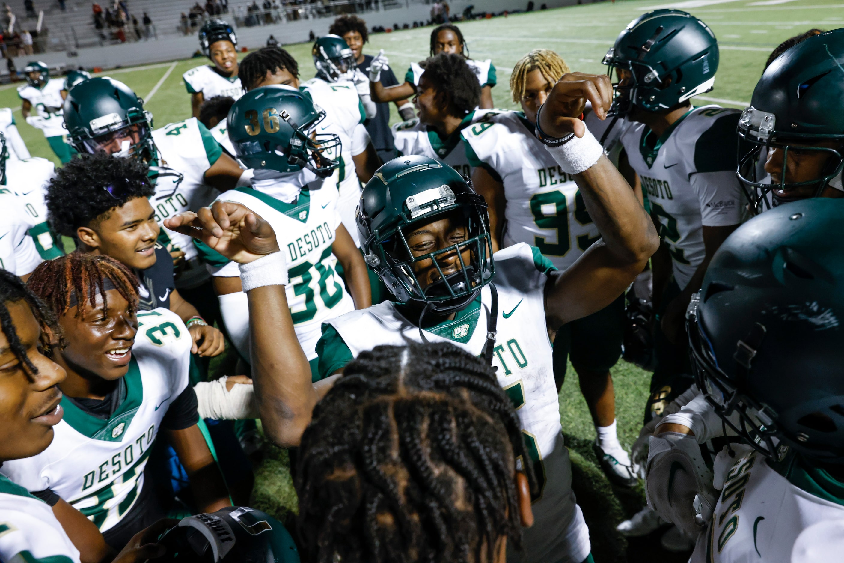 DeSoto players celebrate after winning against Lake Ridge High School during a football game...