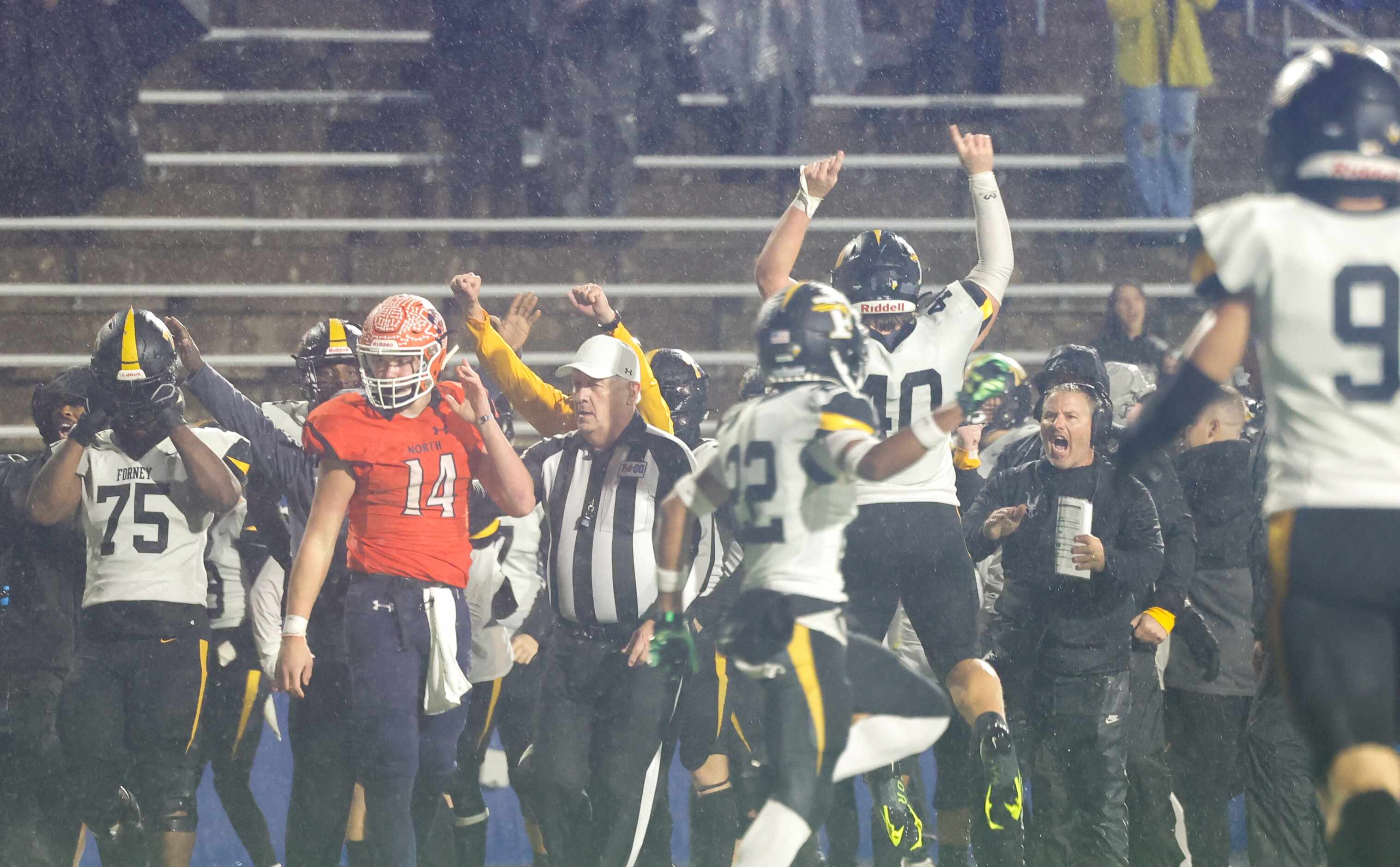Forney players and coaches celebrate an incomplete McKinney North pass in the end zone...
