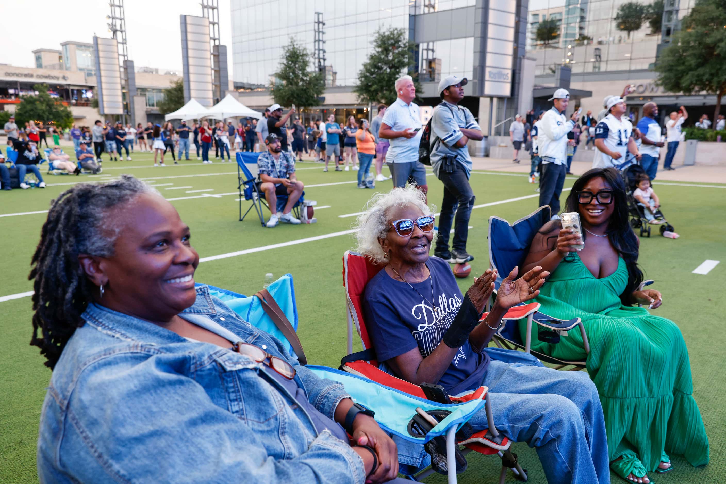 From left, Yvette Richardson, her mother Bobbie, 81, and daughter, Heather Johnson, cheer as...