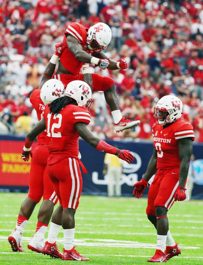 HOUSTON, TX - SEPTEMBER 03:  Brandon Wilson #26 of the Houston Cougars leaps into the air...