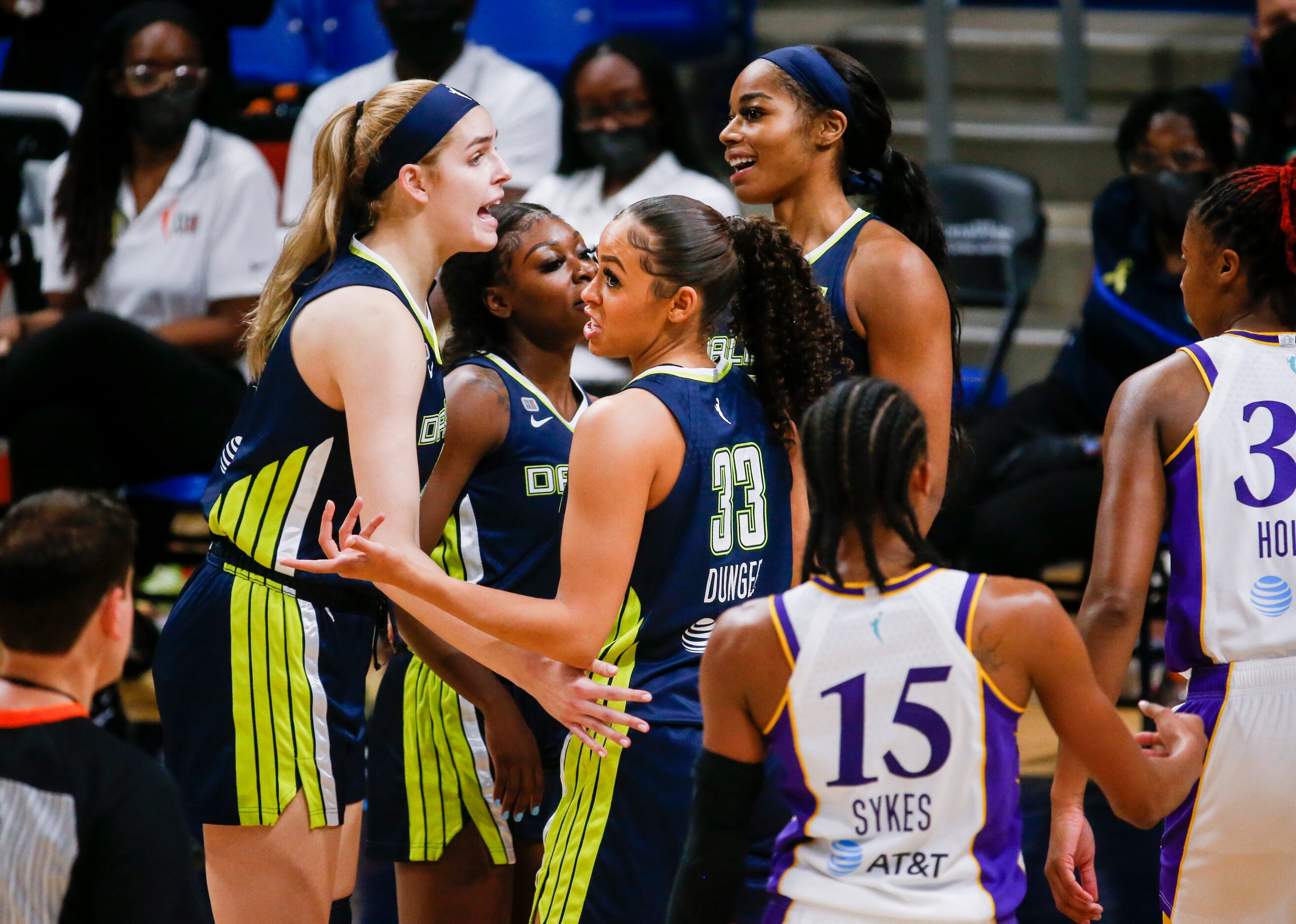 Dallas Wings huddle as they lead against the Los Angeles Sparks in the fourth quarter at...