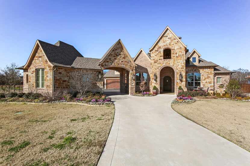 The estate at 2631 Greenspoint Circle in the Estates of Greenspoint provides creek and pond...