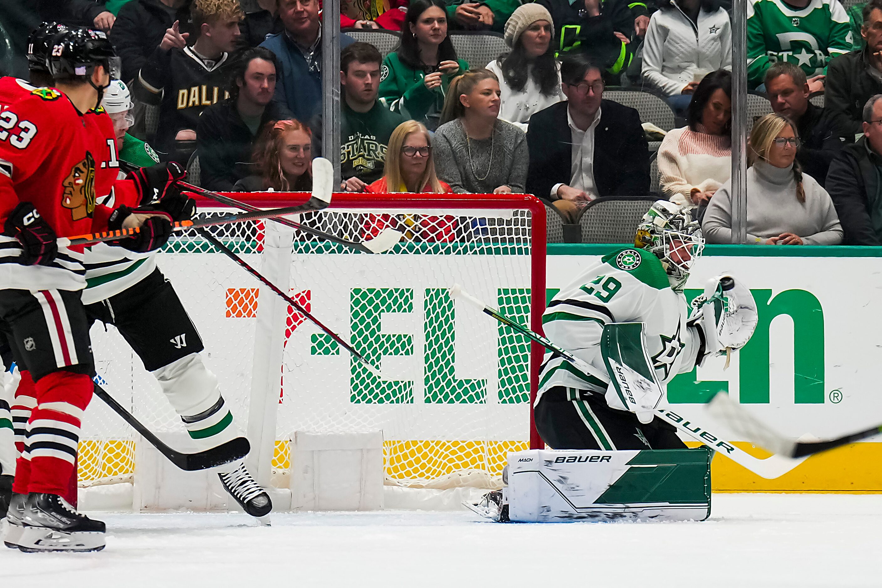 Dallas Stars goaltender Jake Oettinger (29) makes a glove save during the first period of an...