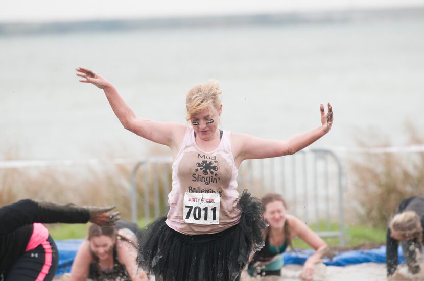 Women competing in the Dirty Girl Mud Run at Cedar Hill State Park on Saturday, Oct. 6,...