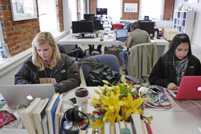 Randall Neely (left) and Sohana Islam are busy at work at the Dallas Entrepreneur Center.
