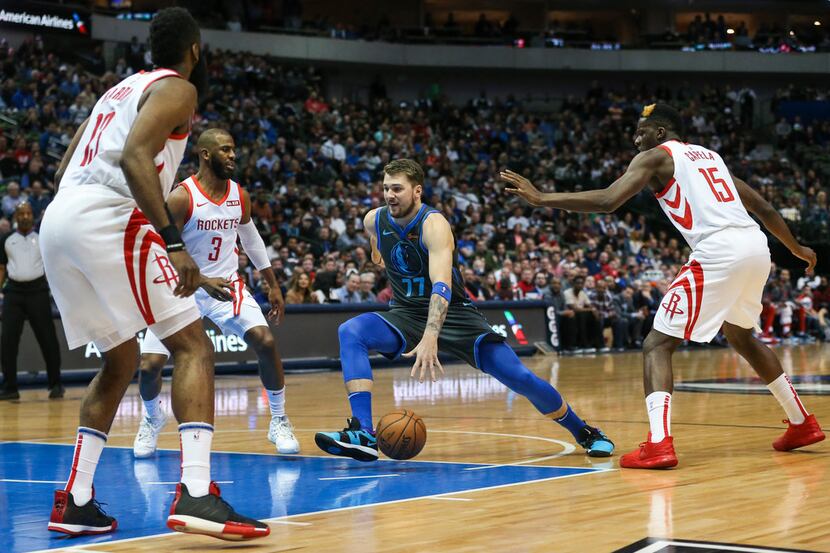 Dallas Mavericks forward Luka Doncic (77) drives in for a shot during the first half a...