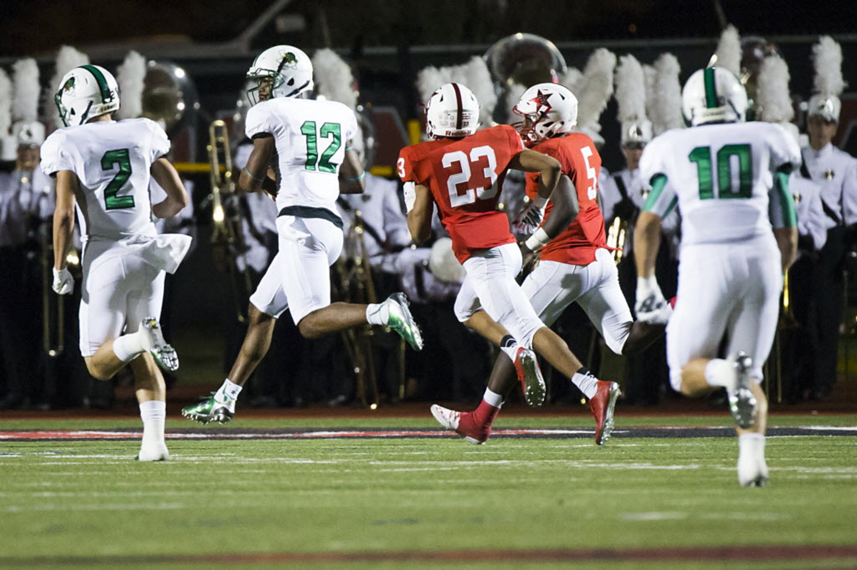 Southlake Carroll wide receiver Zach Farrar (12) races for the end zone past Coppell...