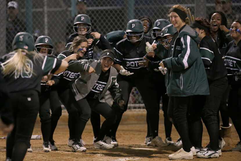 Mesquite Poteet players welcome in Hannah Higgenbottom (10) after her grand slam against...