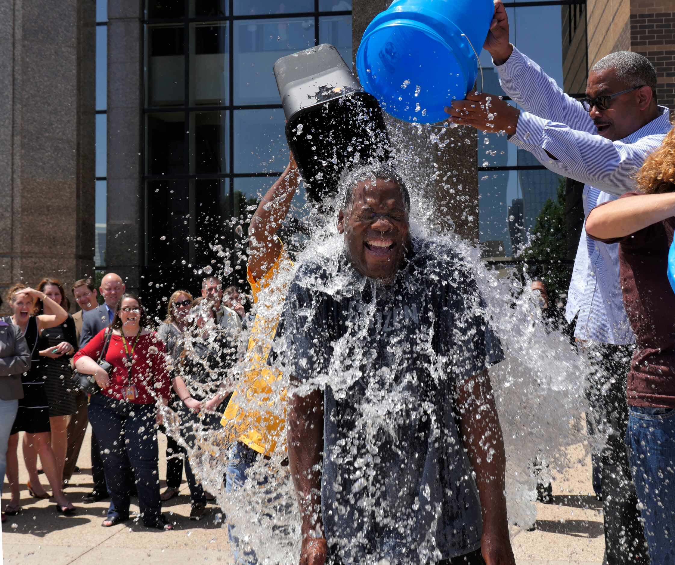 Dallas District Attorney Craig Watkins takes on the ALS ice bucket challenge with three...