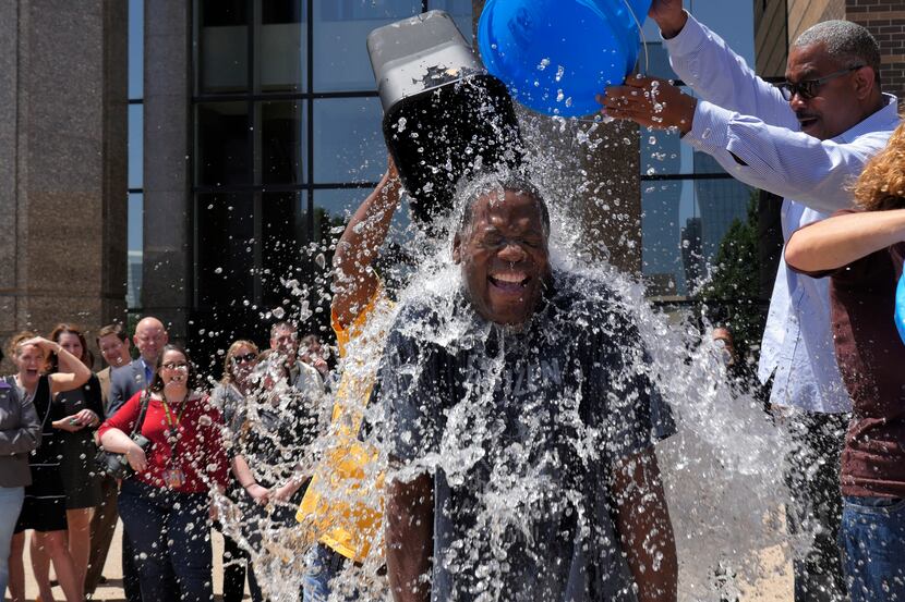 Dallas District Attorney Craig Watkins takes on the ALS ice bucket challenge with three...