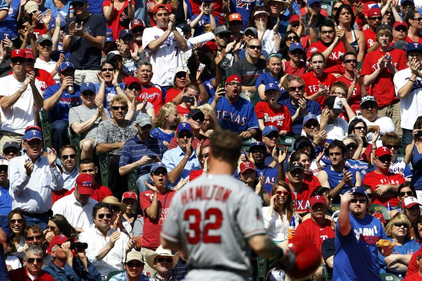 Fans cheer as Los Angeles Angels left fielder Josh Hamilton (32) strikes out against the...