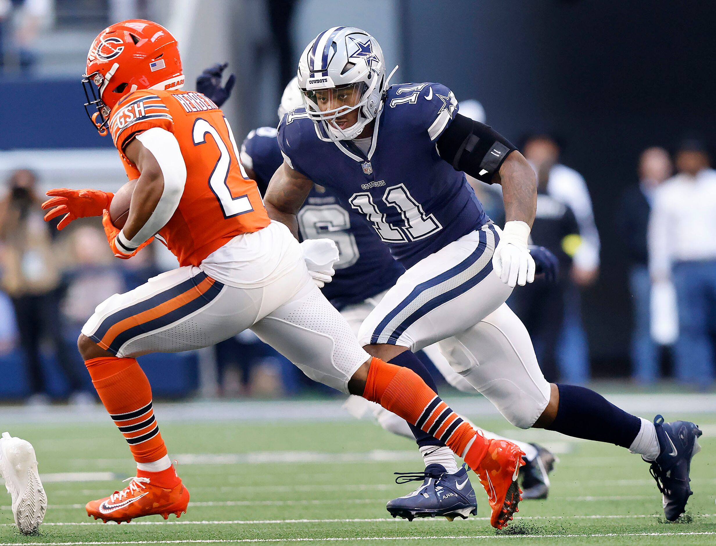 Dallas Cowboys linebacker Micah Parsons (11) gives chase to Chicago Bears running back...