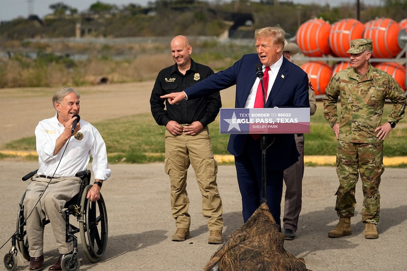 Republican presidential candidate former President Donald Trump points to Texas Gov. Greg...