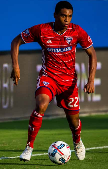 FC Dallas defender Reggie Cannon (22) runs with the ball during the first half of an MLS...