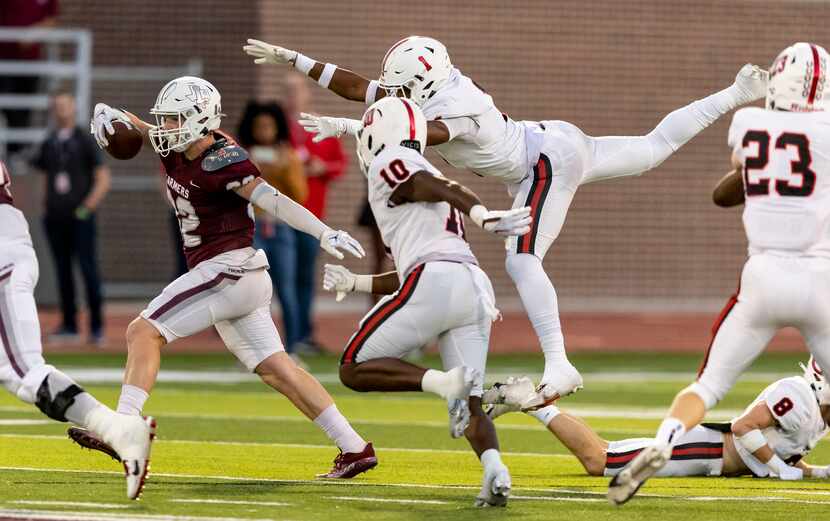 Coppell senior defensive back lkenna Odimegwu (1) and junior linebacker Amari'a Wiley (10)...