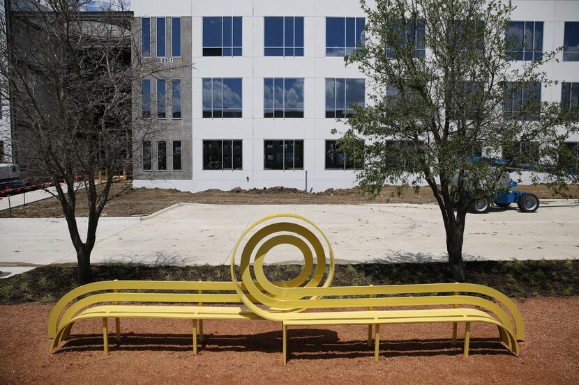 
A sculptural bench sits outside the future headquarters of 7-Eleven in the Cypress Waters...