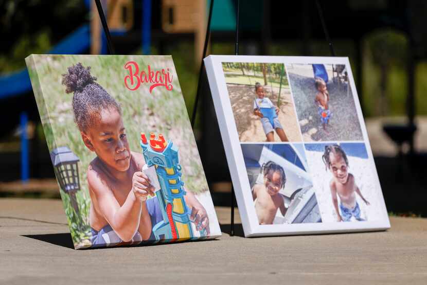 Photos of 3-year-old Bakari Williams sit near the splash pad at Don Misenhimer Park during a...
